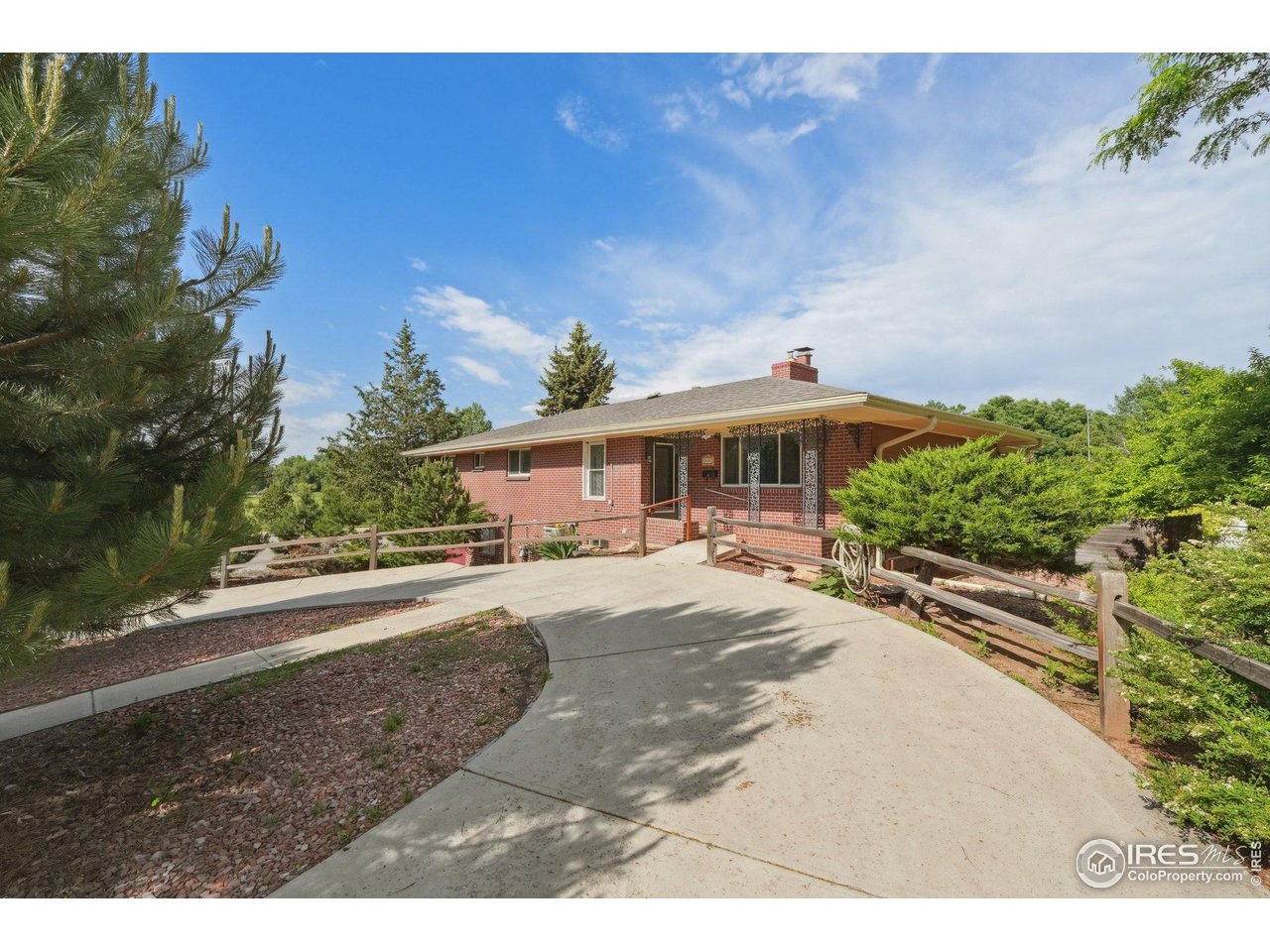 2001 Evergreen Drive Fort Collins, CO 80521 - Photo 1 of 39 a front view of a house with a yard