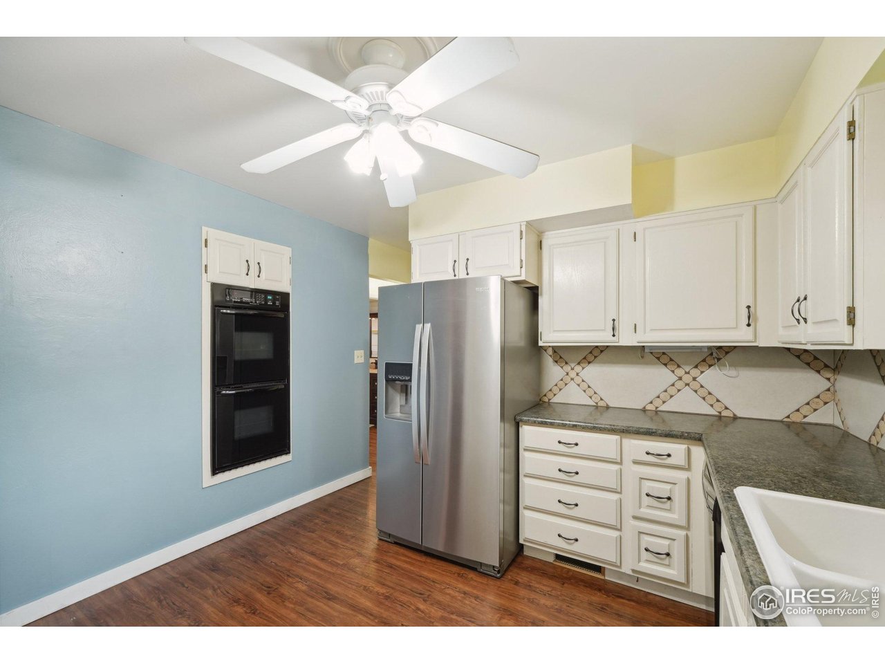 2001 Evergreen Drive Fort Collins, CO 80521 - Photo 12 of 39 a kitchen with stainless steel appliances granite countertop a refrigerator and a stove top oven