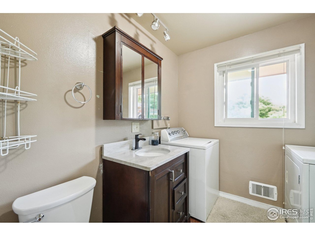 2001 Evergreen Drive Fort Collins, CO 80521 - Photo 19 of 39 a bathroom with a toilet sink and mirror