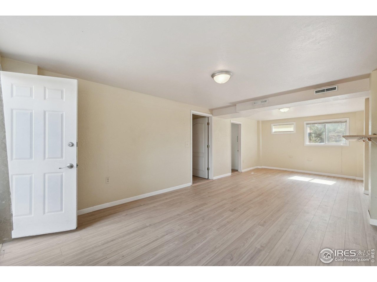 2001 Evergreen Drive Fort Collins, CO 80521 - Photo 21 of 39 a view of an empty room with wooden floor