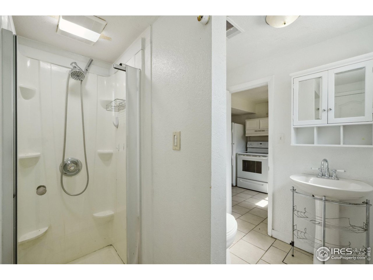 2001 Evergreen Drive Fort Collins, CO 80521 - Photo 27 of 39 a bathroom with a sink a toilet and shower