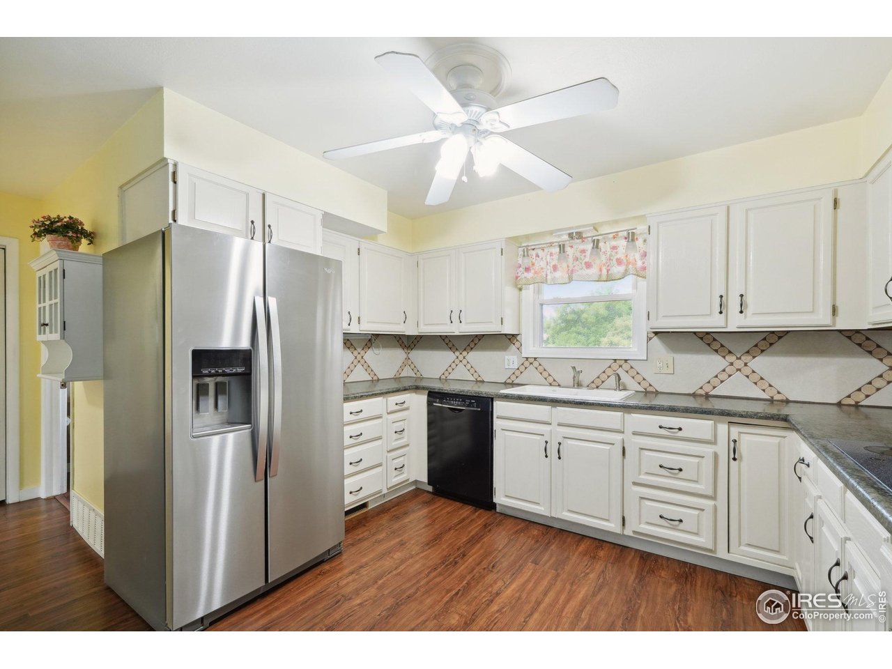 2001 Evergreen Drive Fort Collins, CO 80521 - Photo 10 of 39 a kitchen with stainless steel appliances a refrigerator sink and cabinets
