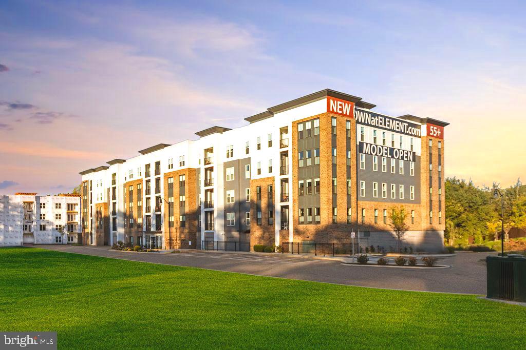 a view of building with yard