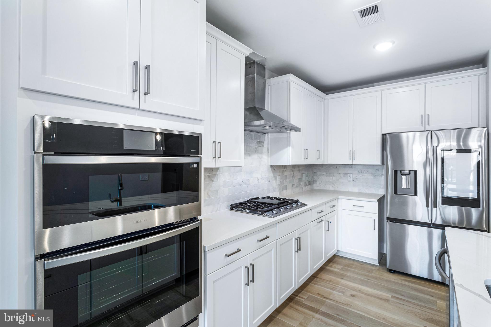 76 Old Mill Bottom Road North, Unit 308 Annapolis, MD 21409 - Photo 16 of 38 a kitchen with stainless steel appliances a stove a microwave and a refrigerator