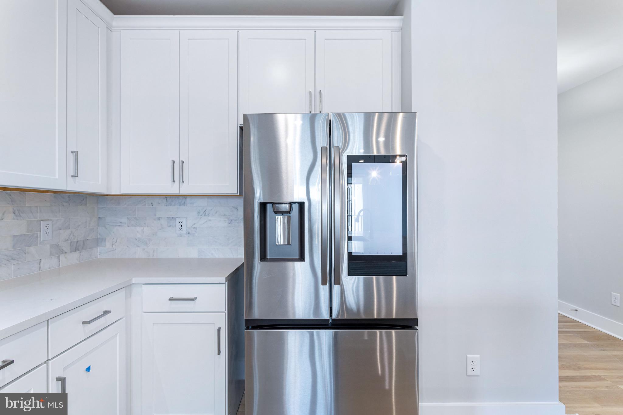 76 Old Mill Bottom Road North, Unit 308 Annapolis, MD 21409 - Photo 22 of 38 a kitchen with cabinets and stainless steel appliances