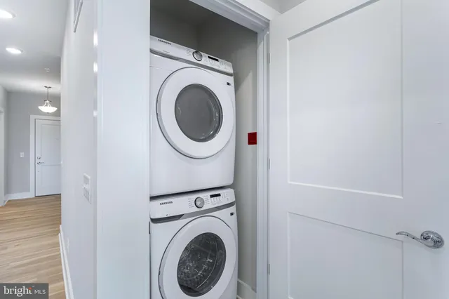 a view of a hallway with washer and dryer
