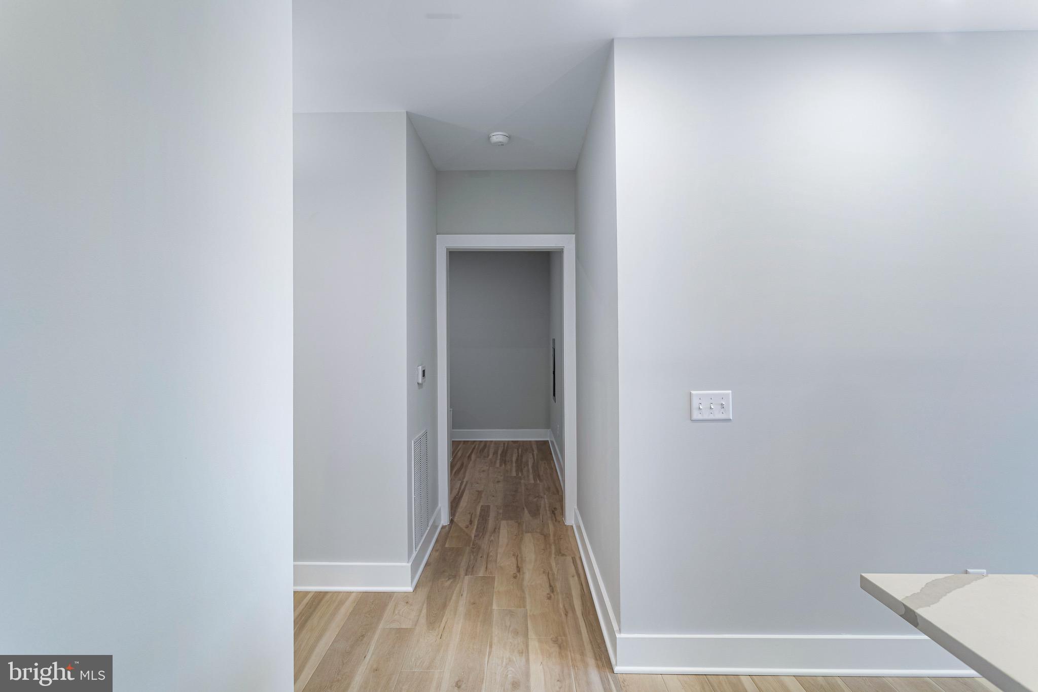 76 Old Mill Bottom Road North, Unit 308 Annapolis, MD 21409 - Photo 28 of 38 a view of a hallway with wooden floor