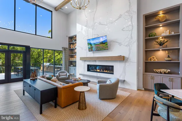 a living room with furniture fireplace and flat screen tv