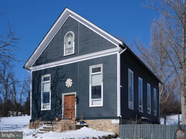 a front view of a house with yard