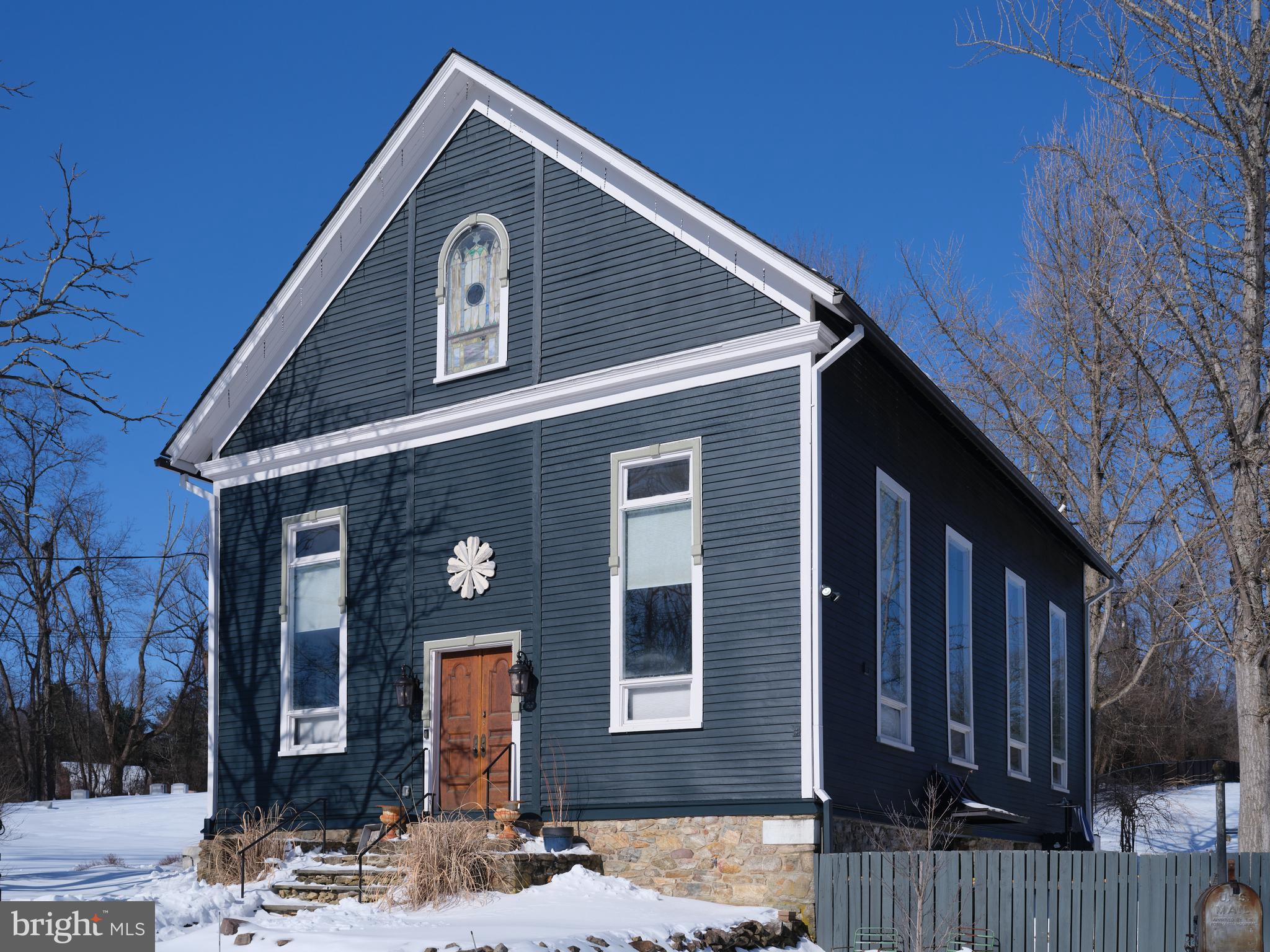 a front view of a house with yard