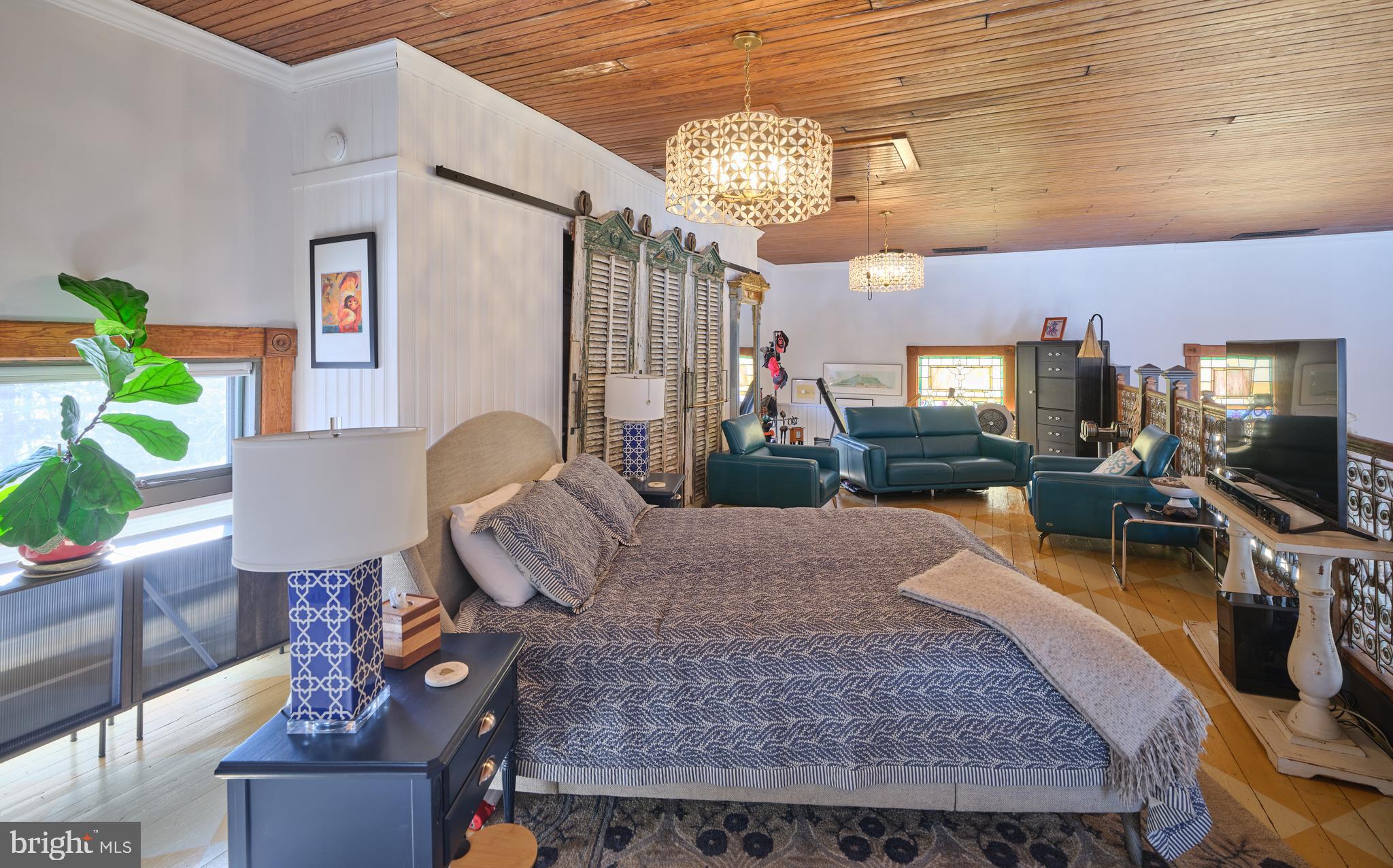 5 Water Street Lebanon, NJ 08833 - Photo 21 of 47 a living room with furniture and a chandelier
