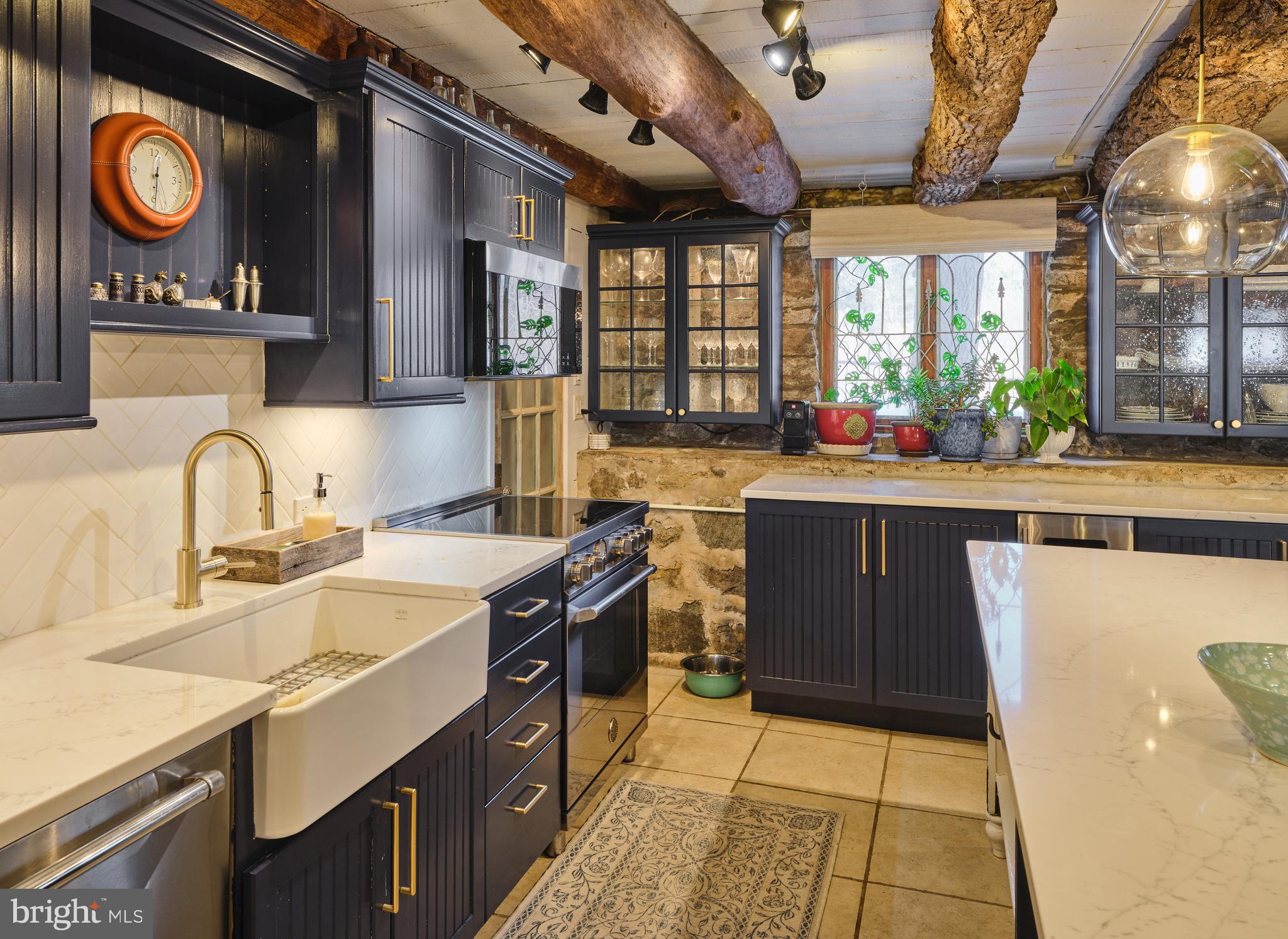 5 Water Street Lebanon, NJ 08833 - Photo 34 of 47 a kitchen with stainless steel appliances granite countertop a sink stove and cabinets