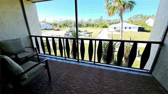 a view of balcony with furniture