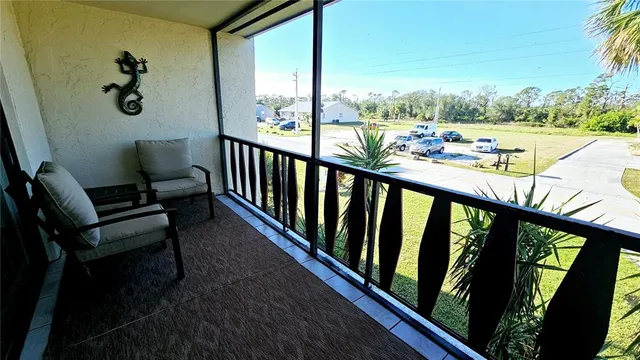 a view of a balcony with chairs