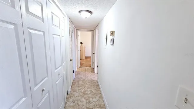 a view of a hallway with a white door