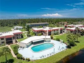 a view of a swimming pool with a patio