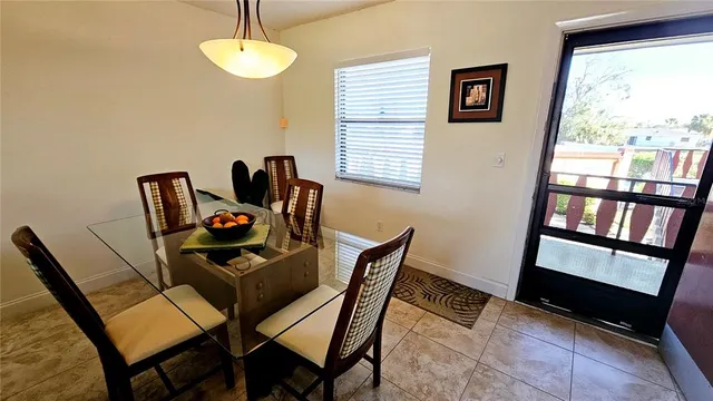 a dining room with furniture and window