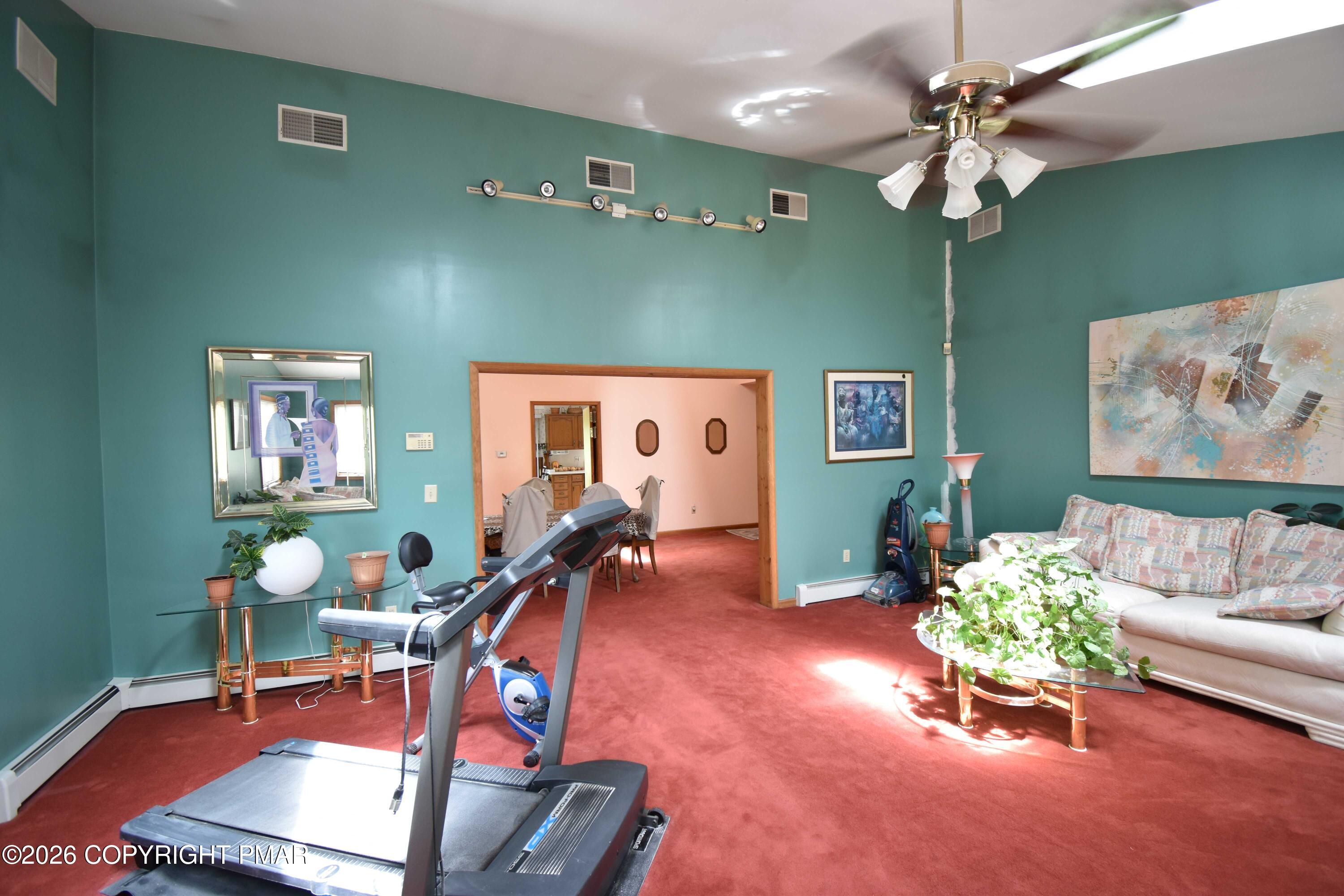 160 Quiet Valley Road Mount Bethel, PA 18343 - Photo 15 of 44 a room with furniture and a chandelier