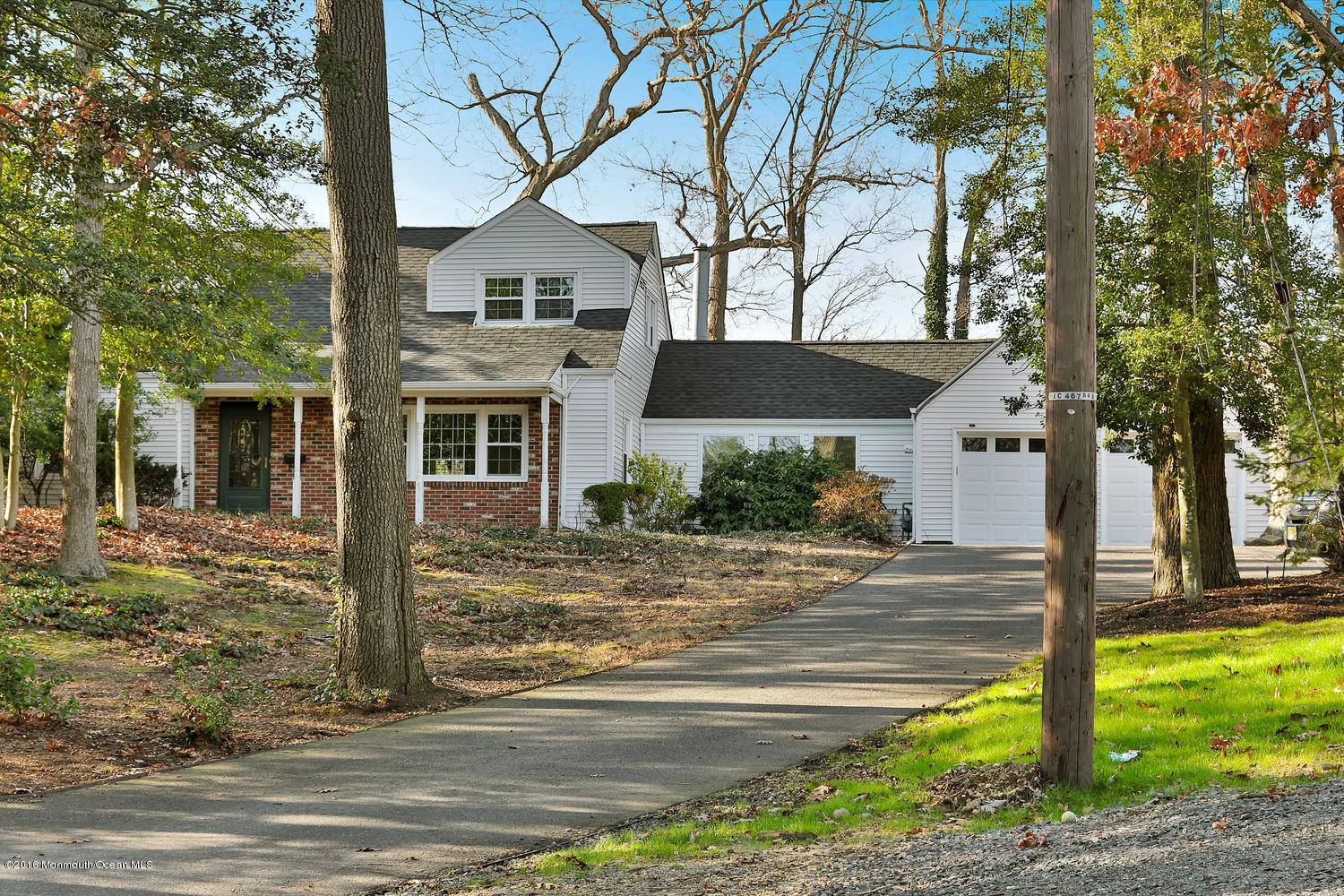 717 Schoolhouse Road Brielle, NJ 08730 - Photo 1 of 22 a front view of a house with garden