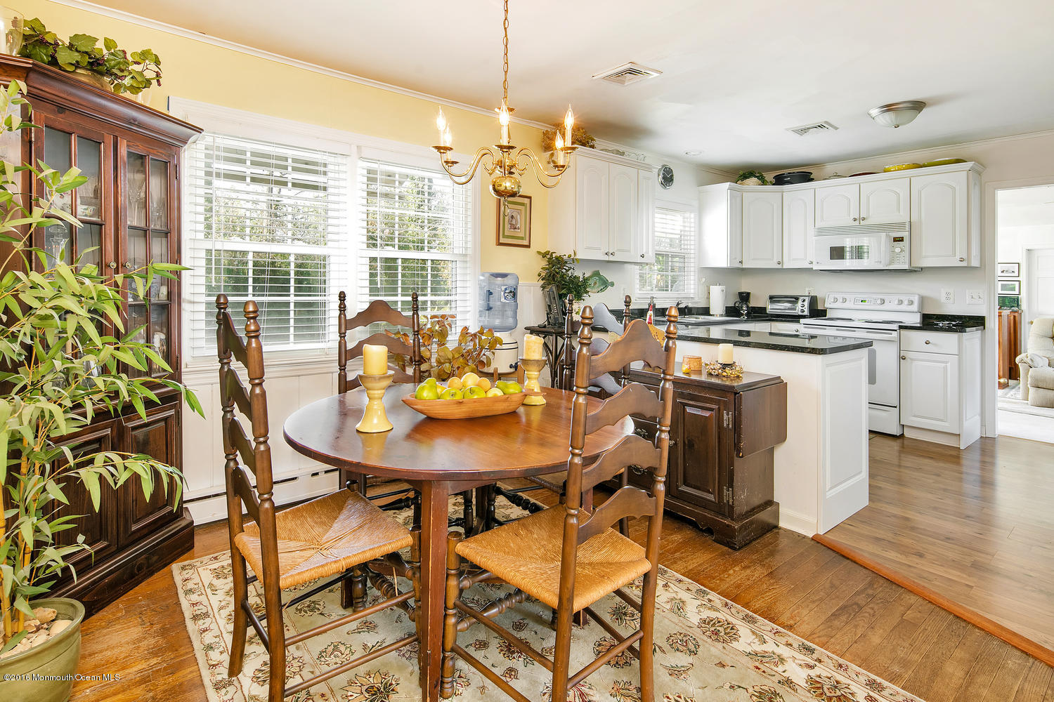 717 Schoolhouse Road Brielle, NJ 08730 - Photo 14 of 22 a view of a dining room with furniture and wooden floor