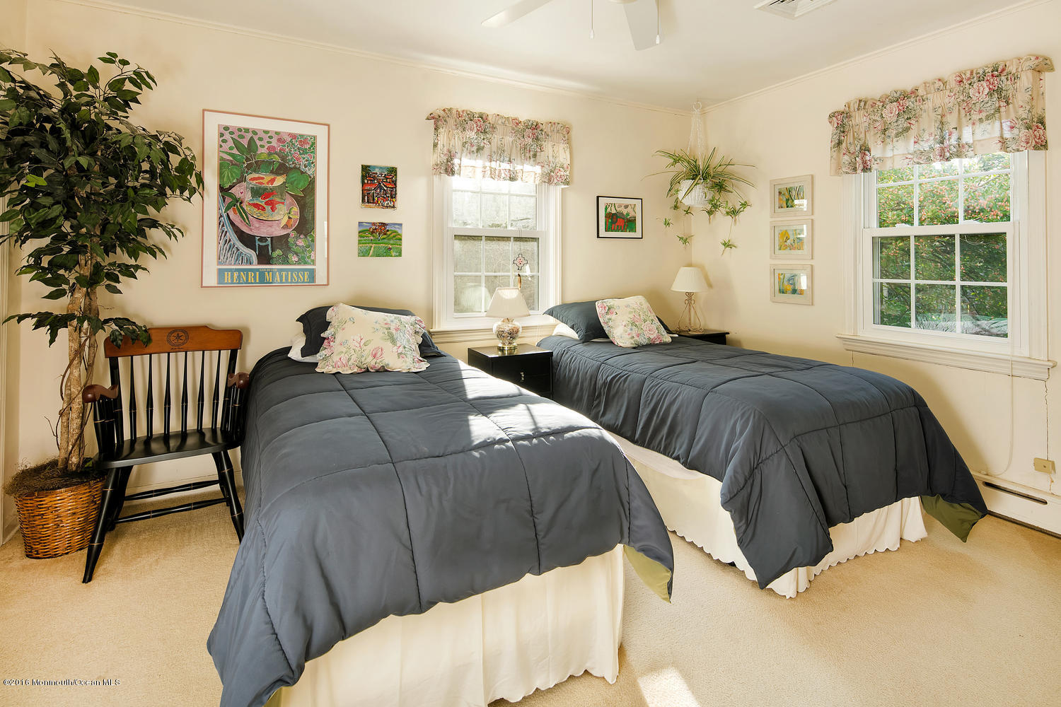 717 Schoolhouse Road Brielle, NJ 08730 - Photo 15 of 22 a bedroom with two beds and a large window with outer view