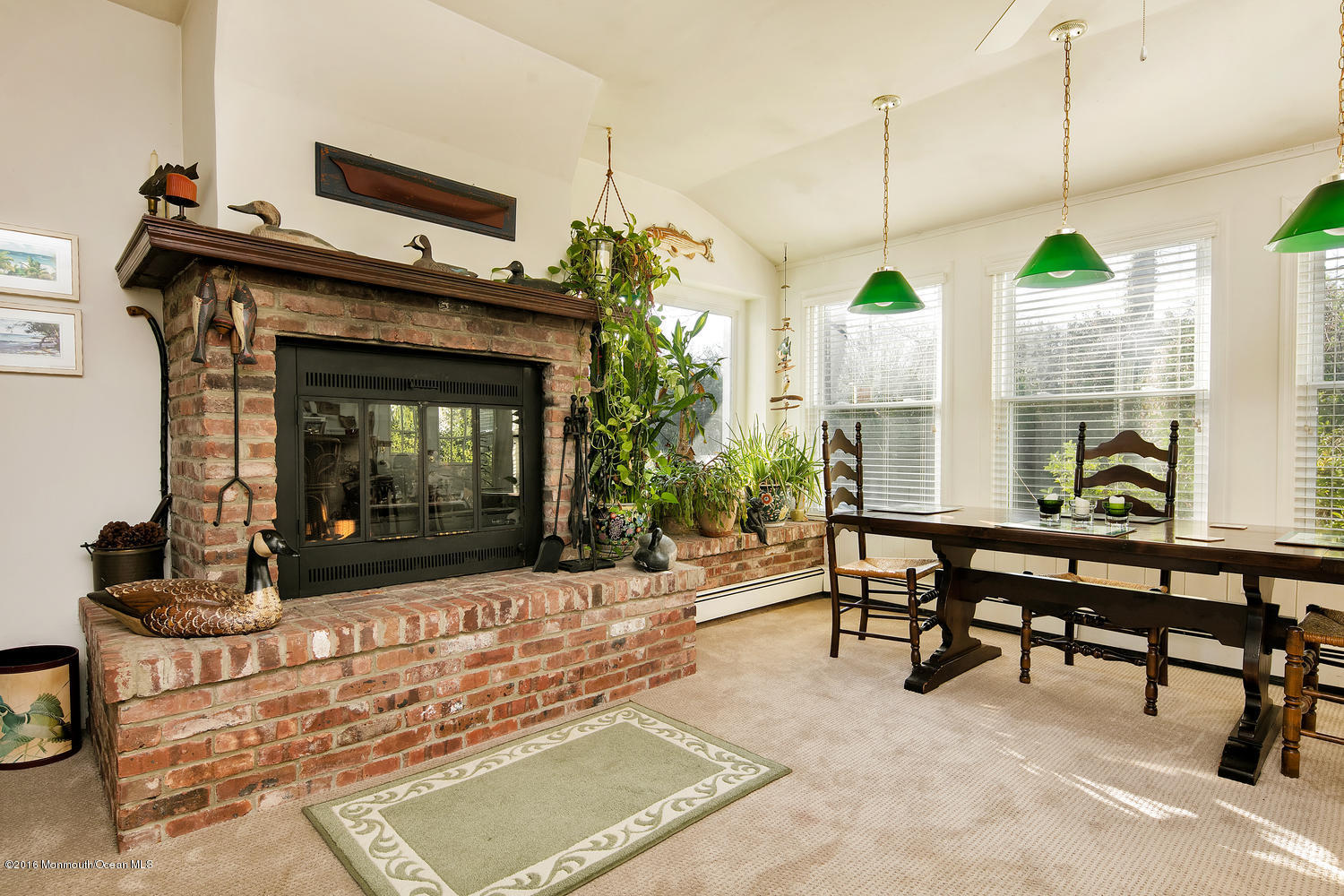 717 Schoolhouse Road Brielle, NJ 08730 - Photo 18 of 22 a living room with furniture a window and a fireplace