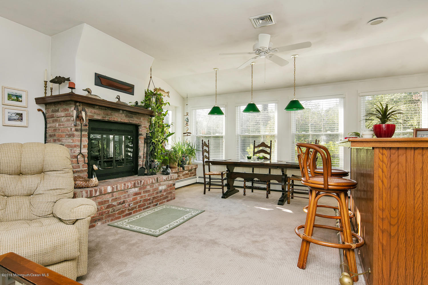 717 Schoolhouse Road Brielle, NJ 08730 - Photo 19 of 22 a living room with furniture and a fireplace