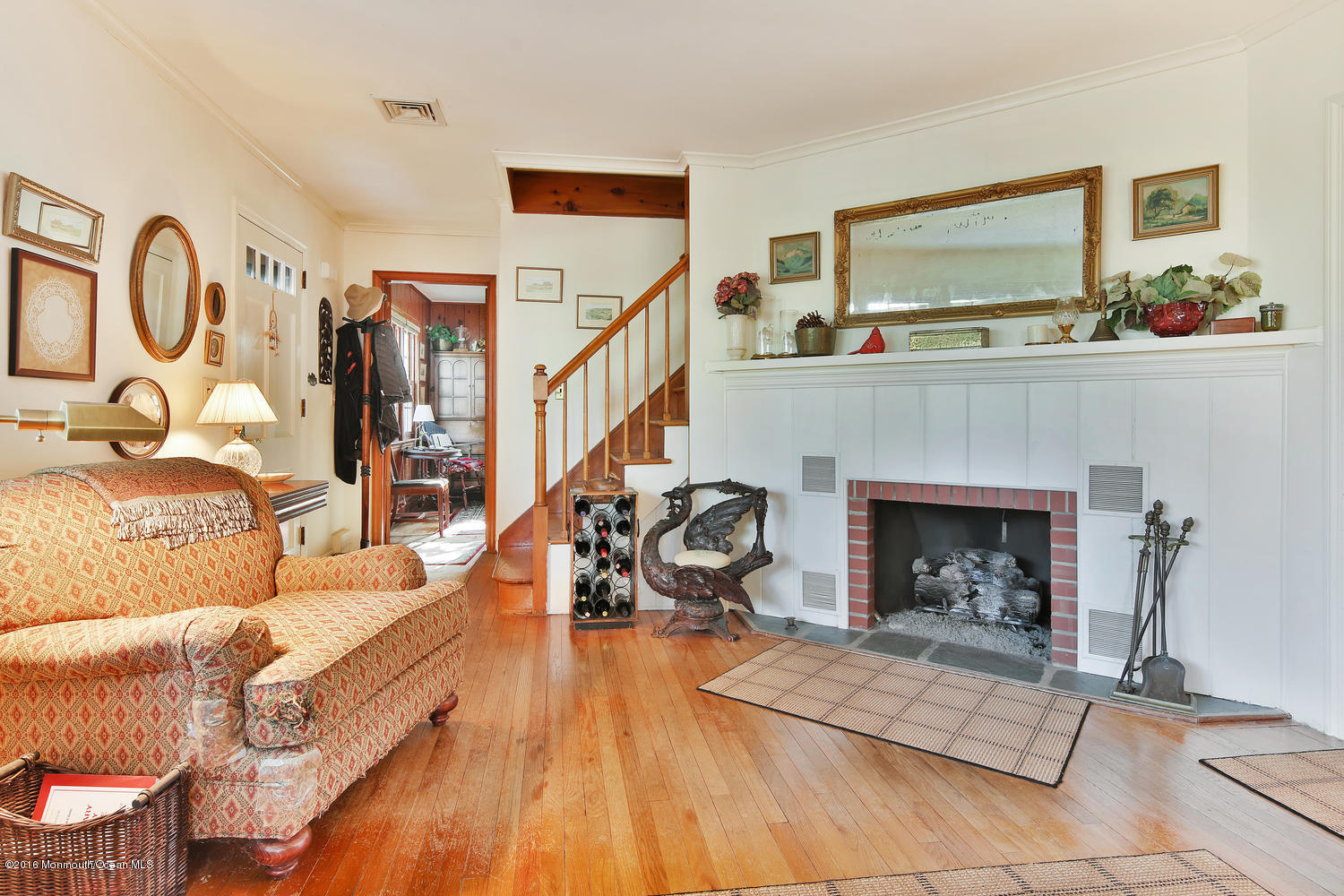 717 Schoolhouse Road Brielle, NJ 08730 - Photo 4 of 22 a living room with furniture and a fireplace