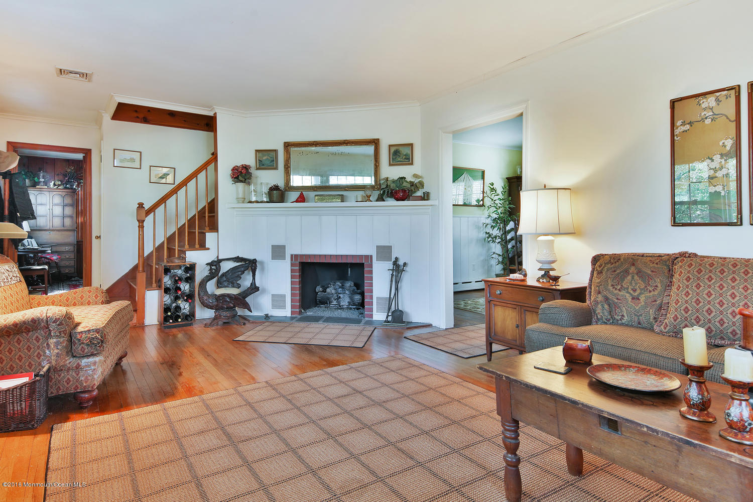 717 Schoolhouse Road Brielle, NJ 08730 - Photo 6 of 22 a living room with furniture and a fireplace