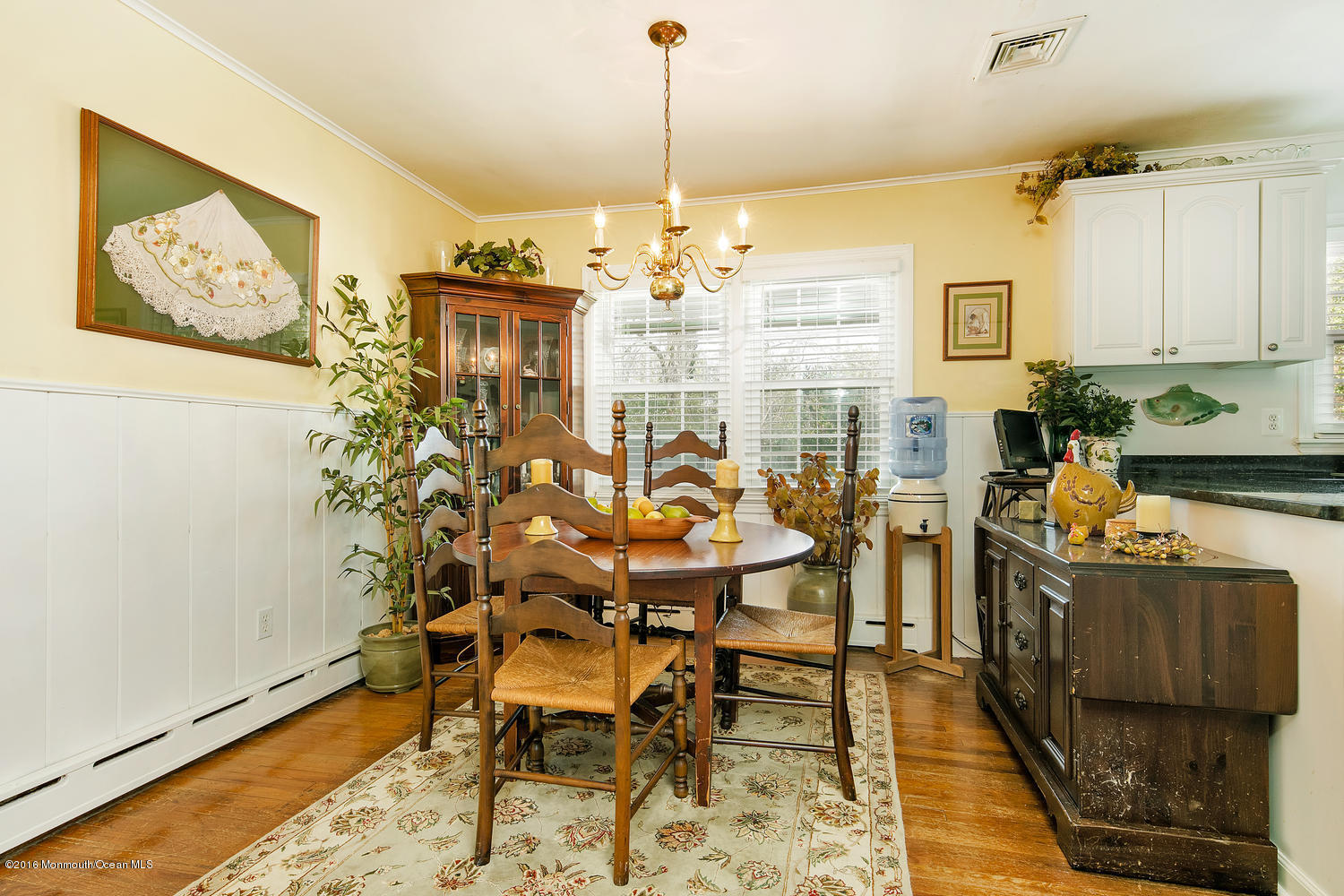 717 Schoolhouse Road Brielle, NJ 08730 - Photo 10 of 22 a view of a dining room with furniture and chandelier