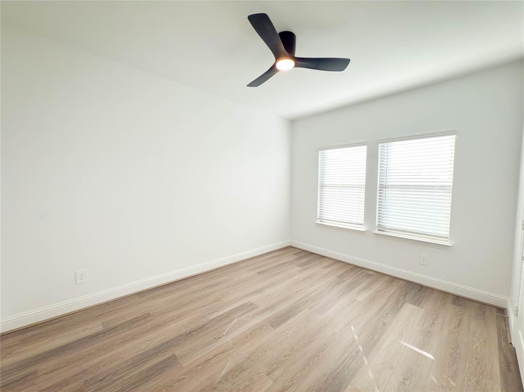 114 Settlers Way Euless, TX 76040 - Photo 12 of 38 an empty room with a window