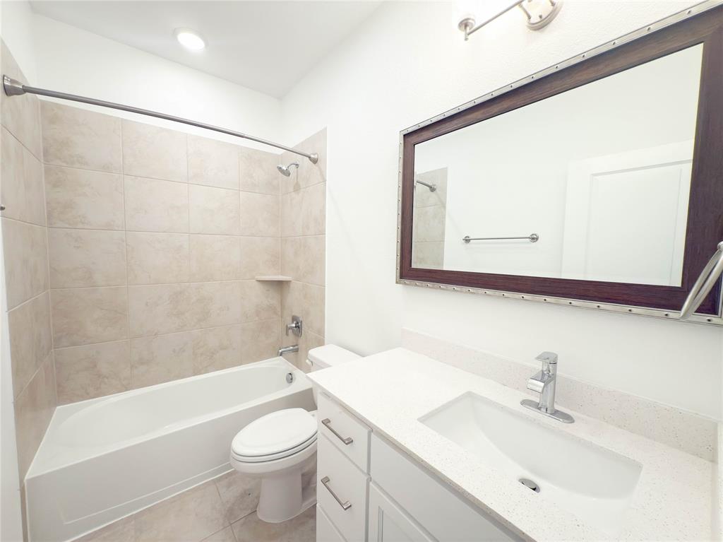 114 Settlers Way Euless, TX 76040 - Photo 14 of 38 a bathroom with a sink a toilet and shower
