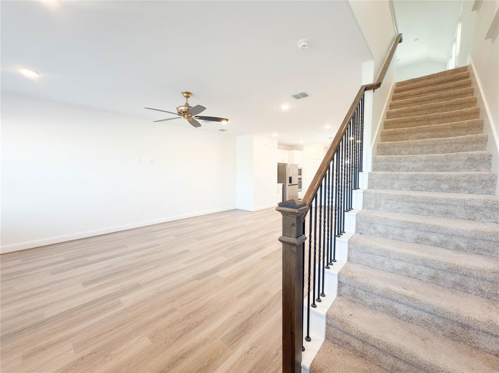 114 Settlers Way Euless, TX 76040 - Photo 15 of 38 a view of entryway and hall with wooden floor