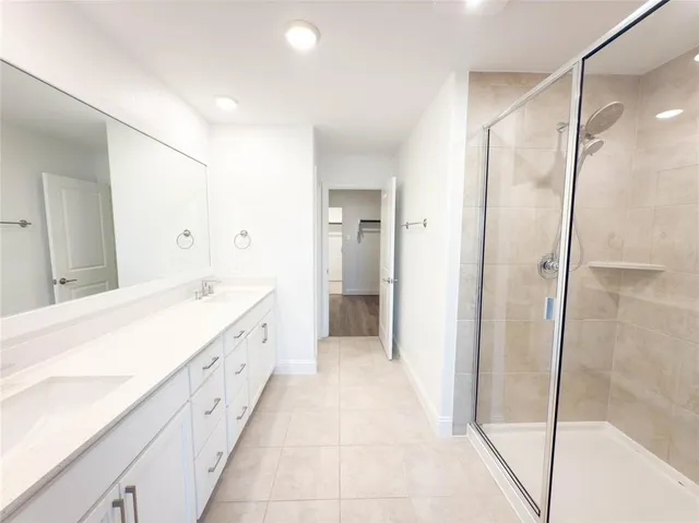 a spacious bathroom with a bathtub and a shower