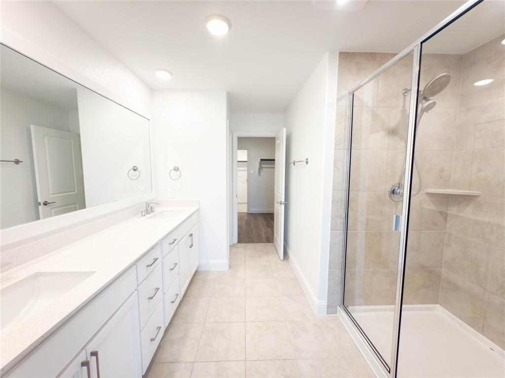 114 Settlers Way Euless, TX 76040 - Photo 21 of 38 a spacious bathroom with a bathtub and a shower