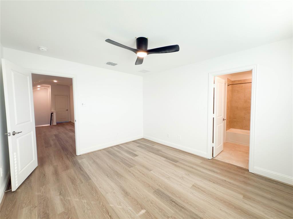 114 Settlers Way Euless, TX 76040 - Photo 28 of 38 wooden floor in an empty room