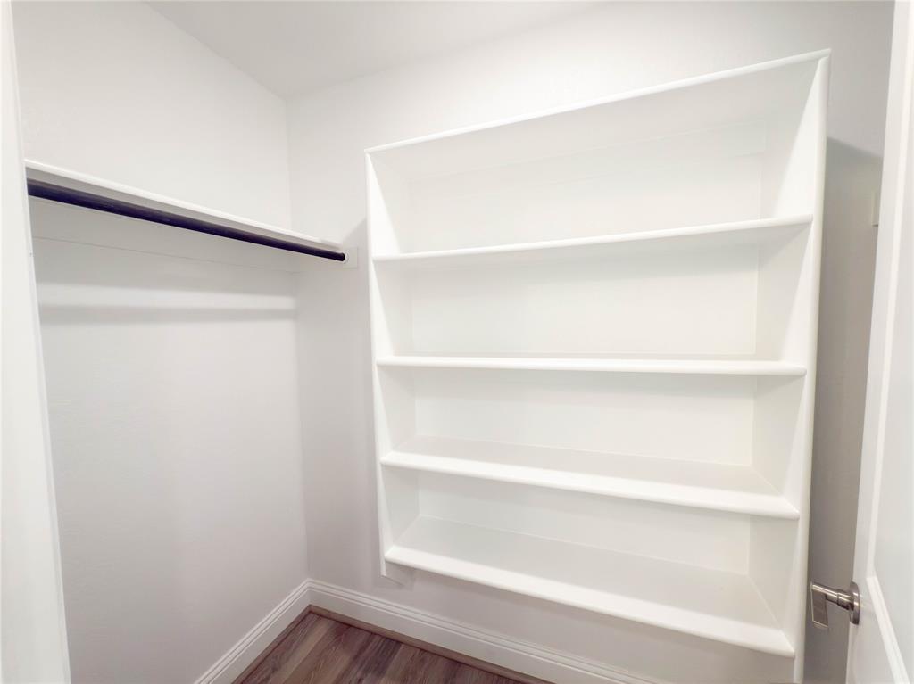 114 Settlers Way Euless, TX 76040 - Photo 30 of 38 a view of an empty walk in closet