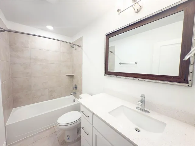 a bathroom with a sink a toilet and a bathtub