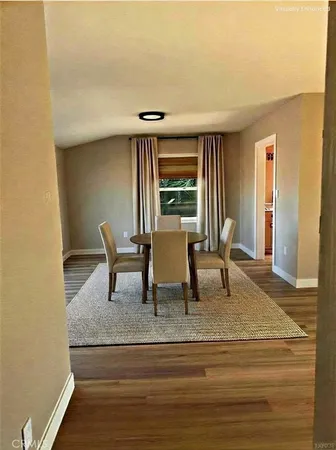 a kitchen with wooden floors and a stove