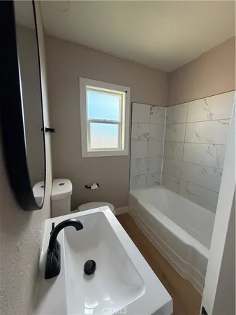 a bathroom with a toilet and a sink