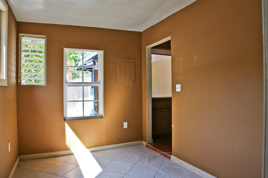1247 East Valley Road Santa Barbara, CA 93108 - Photo 8 of 24 a view of an empty room with wooden floor and a window