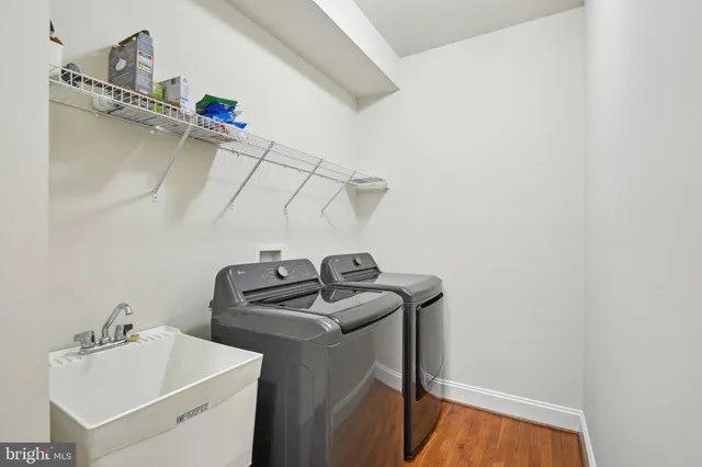 a bedroom with a bed and a potted plant