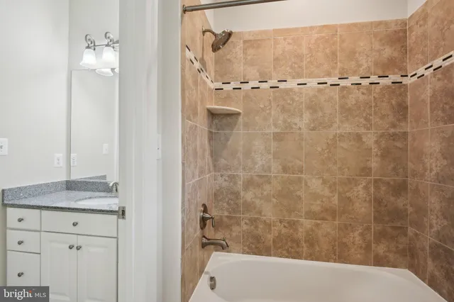 an aerial view of a houses with a yard