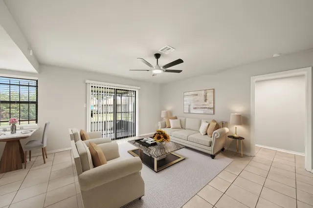 a living room with furniture and a window