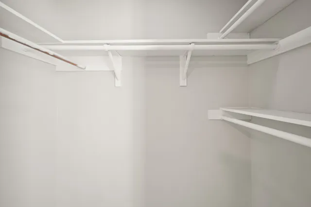 a view of a room with racks on the wall