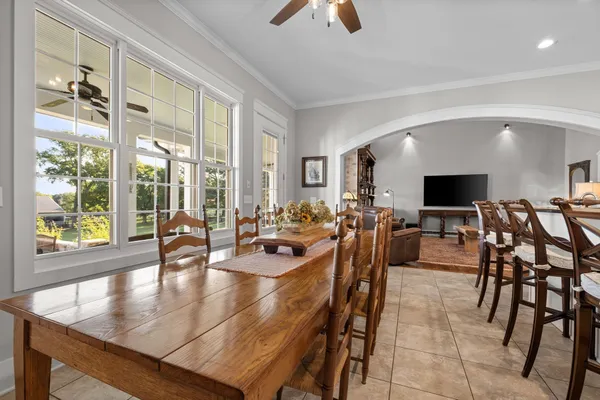 a kitchen with granite countertop a sink a stove and cabinets