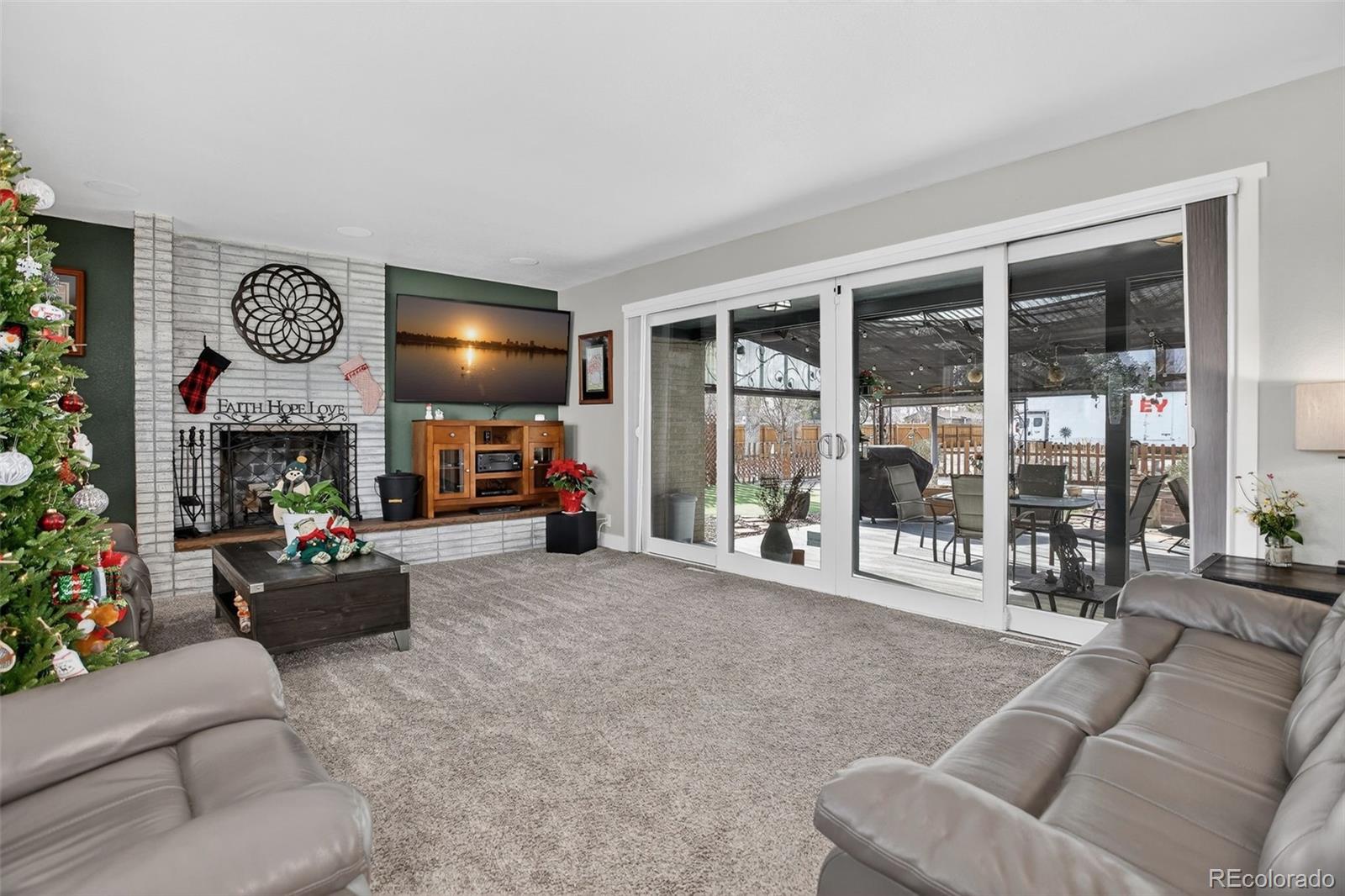 1313 Laredo Street Aurora, CO 80011 - Photo 5 of 23 a living room with furniture and a large window