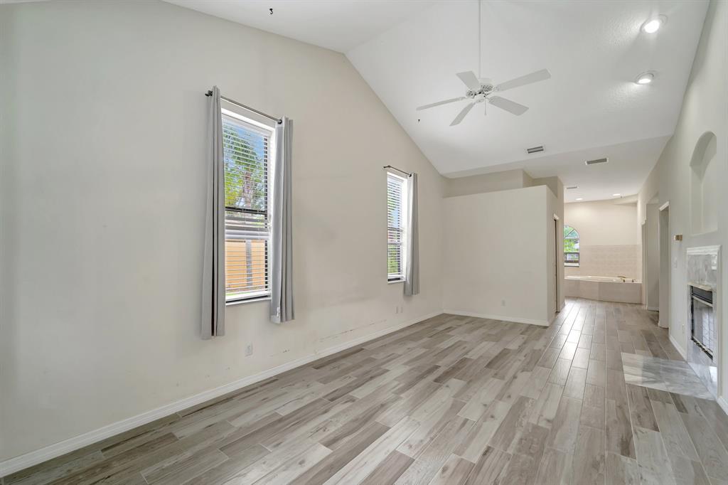 8040 Conservatory Circle Sarasota, FL 34243 - Photo 12 of 52 wooden floor in an empty room with a window