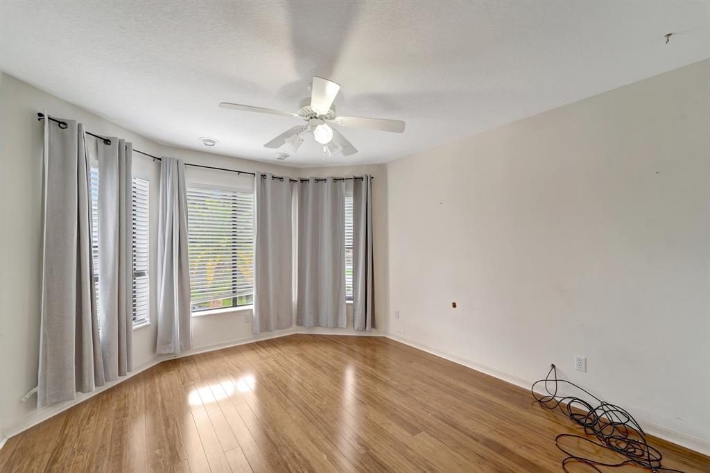 8040 Conservatory Circle Sarasota, FL 34243 - Photo 14 of 52 wooden floor in an empty room with a window
