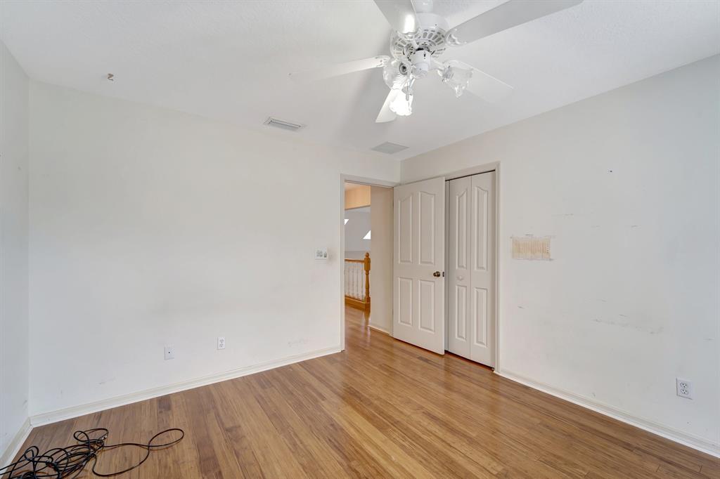8040 Conservatory Circle Sarasota, FL 34243 - Photo 16 of 52 a view of an empty room with wooden floor